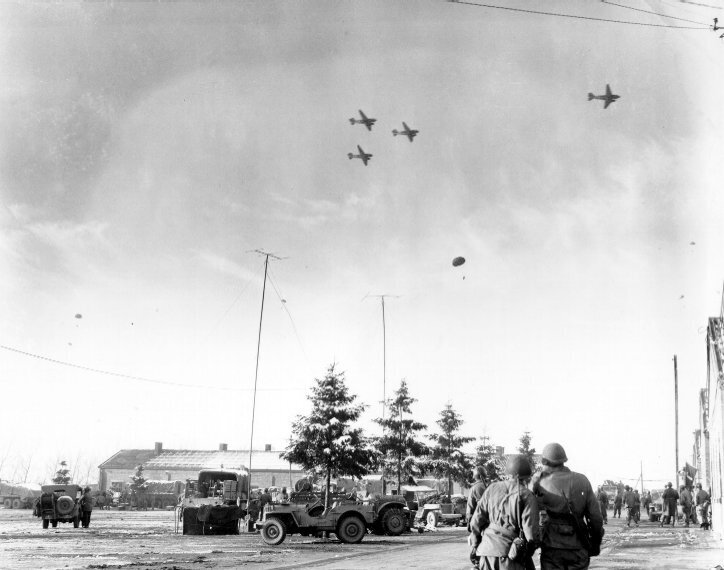 Watching_C-47’s_drop_supplies.jpg Watching_C-47’s_drop_supplies.jpg